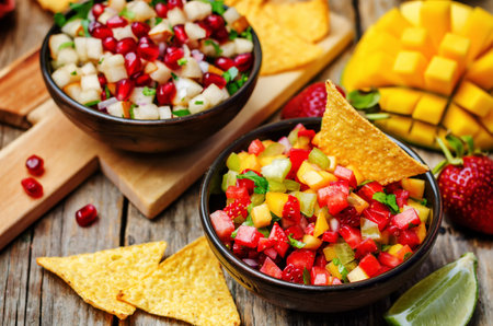 strawberry mango pepper and pomegranate pear salsa. toning. selective focus