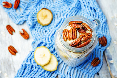 homemade healthy Chia seeds and banana overnight oatmeal in jar. toning. selective Focus