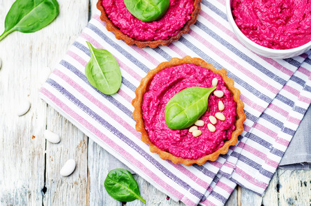 beet white bean hummus rye tartlets. toning. selective focusの写真素材