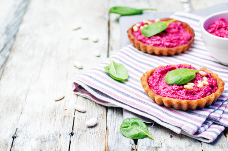 beet white bean hummus rye tartlets. toning. selective focus