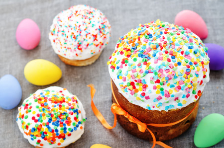 Easter cake with colorful topping on a grey background. tinting. selective focusの写真素材