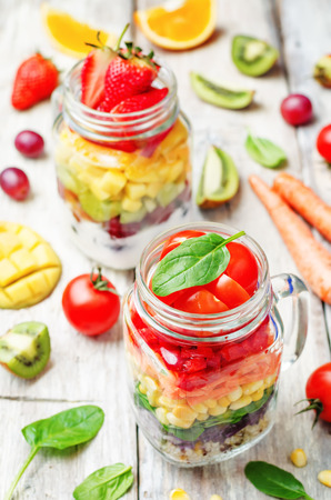 homemade rainbow salads with vegetables, quinoa, Greek yogurt and fruit. toning. selective focusの写真素材