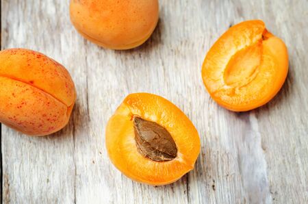 apricots on a white wooden background. toning. selective focusの写真素材
