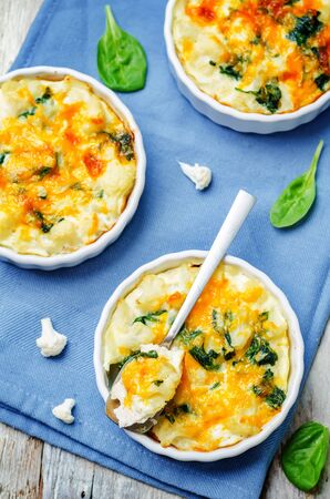 Chicken Spinach Cauliflower casserole on white wood background. toning. selective focusの写真素材