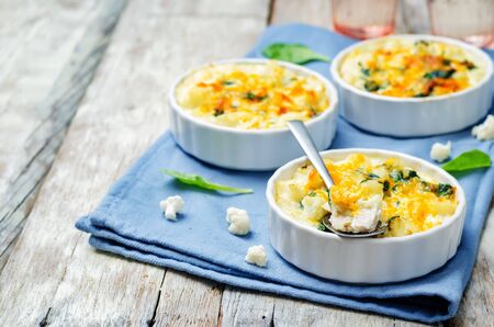 Chicken Spinach Cauliflower casserole on white wood background. toning. selective focusの写真素材