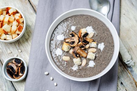 White bean mushrooms soup with croutons. toning. selective focusの写真素材