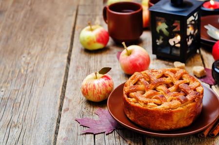 Apple pie on a dark wooden background. toning. selective focusの写真素材