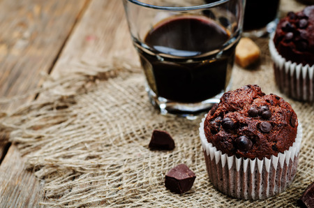 chocolate chips, chocolate muffin and coffee. toning. selective focusの写真素材