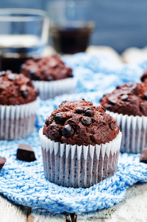 chocolate chips, chocolate muffin and coffee. toning. selective focusの写真素材