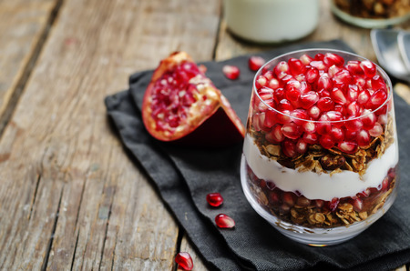 Greek yogurt granola Pomegranate parfait. toning. selective focusの写真素材