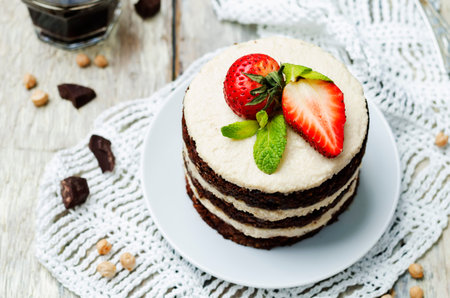 chocolate chickpeas vegan cake with cashew cream. toning. selective focus