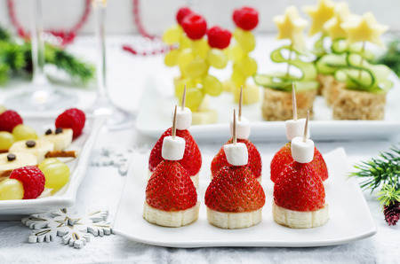 Assortment of New Year's snacks and a glass of champagne. toning. selective focusの写真素材