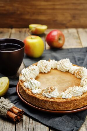 apple pie decorated with whipped cream. toning. selective focusの写真素材