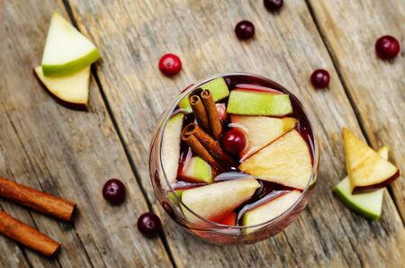 Red and green apple cranberry cinnamon sangria. toning. selective focusの写真素材