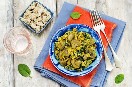 Mushrooms spinach turmeric brown rice. toning. selective focusの写真素材