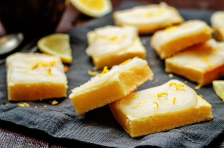 Lemon bars with lemon icing. toning. selective focusの写真素材