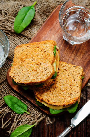 Spinach tomato cheese grilled rye sandwiches. toning. selective focusの写真素材