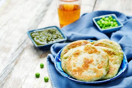 Spicy green peas Flatbread. Bengali Matar Kachori. Indian cuisine. toning. selective focusの写真素材