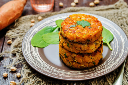 Sweet potatoes chickpea cilantro oats vegan burgers. toning. selective focusの写真素材