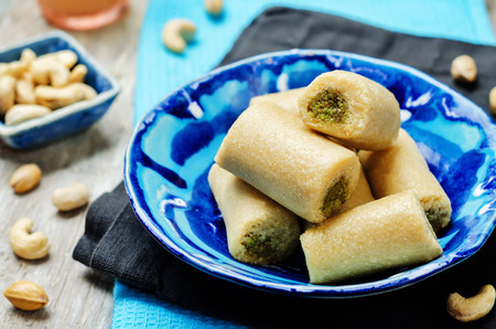 Cashew Pistachio roll. Kaju pista roll. Indian sweets. toning. selective focusの写真素材