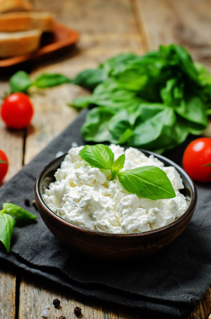 ricotta cheese on a wood background. the toning. selective focusの写真素材