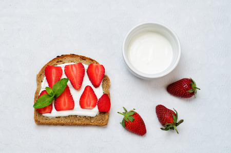 Healthy greek yogurt strawberry rye breakfast sandwich. toning. selective focusの写真素材