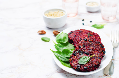 Black beans quinoa beet walnuts burgers with spinach. tinting. selective focusの写真素材