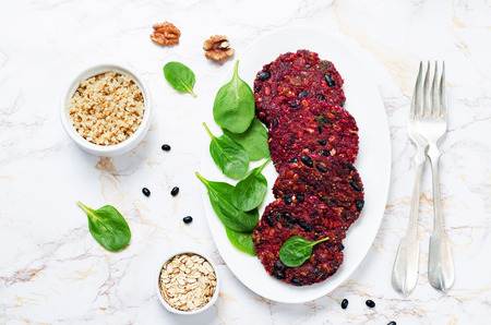 Black beans quinoa beet walnuts burgers with spinach. tinting. selective focusの写真素材