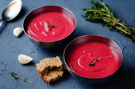Potato Beet soup with Thyme on a dark background. toning. selective focusの写真素材