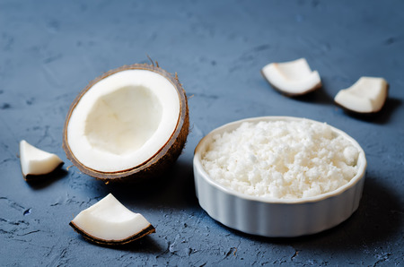 Coconut chips on a dark background. toning. selective focusの写真素材