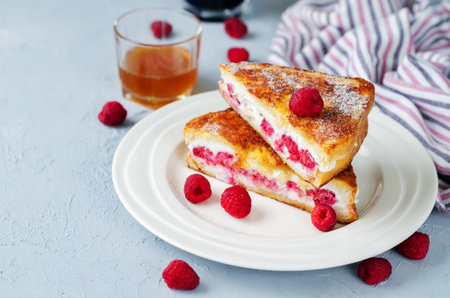 Ricotta raspberry stuffed French Toasts. toning. selective focus