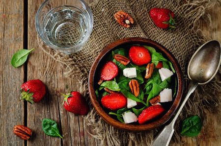 Strawberry spinach goat cheese pecan salad. toning. selective focusの写真素材