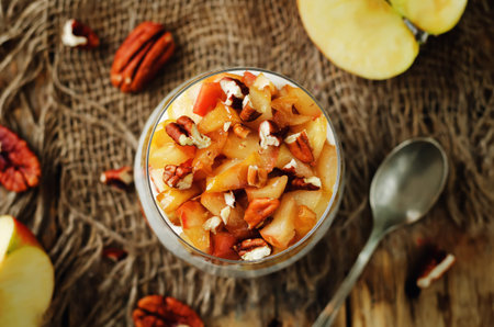Caramelized apples pecan greek yogurt parfait. toning. selective focusの写真素材