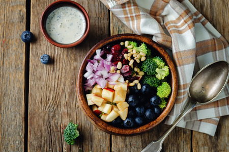 Broccoli blueberry apple salad with greek yogurt poppy seeds dressing. toning. selective focusの写真素材