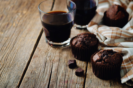 Chocolate chips oats chocolate muffins on a wood background. toning. selective focusの写真素材