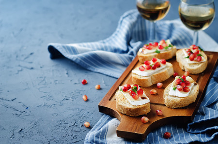 Pomegranate Brie balsamic crostini. toning. selective focusの写真素材