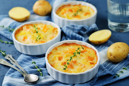 Pumpkin potato gratin on a stone background. toning. selective focusの写真素材
