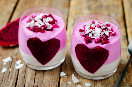 Greek yogurt pitaya Chia seeds parfait on a wood background. toning. selective focusの写真素材
