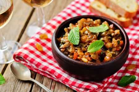 Sicilian Eggplant pine nuts Caponata. toning. selective focusの写真素材