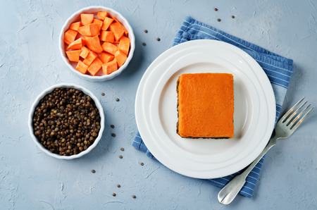 Vegan sweet potato Shepherd's pie on a stone background. toning. selective focusの写真素材