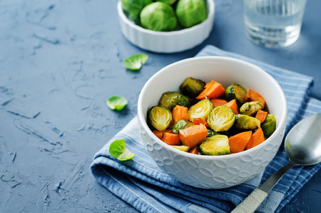Roasted Sweet potato and Brussels Sprouts on a stone background. toning. selective focusの写真素材