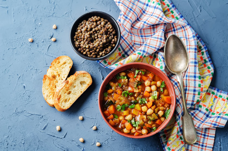 Moroccan spicy green lentils chickpea soup on a stone background. toning. selective focusの写真素材