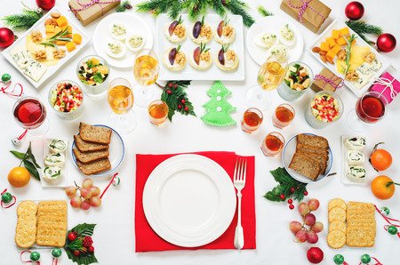 Christmas appetizers celebration table setting. toning. selective focusの写真素材
