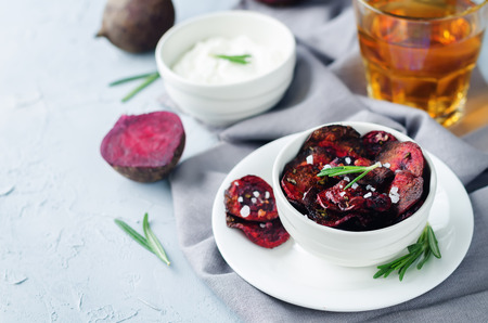 Rosemary sea salt beet chips on a stone background. toning. selective focusの写真素材