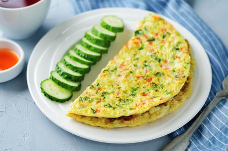 Indian Masala Omelette with cucumbers on a stone background. toning. selective focusの写真素材