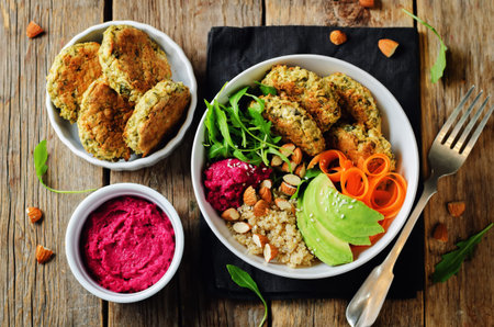 Quinoa Beet Hummus Falafel Bowl on a wood background. toning. selective focusの写真素材
