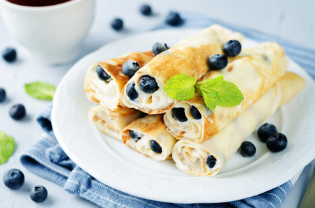 Sauteed Cream cheese Blueberry Crepes on a stone background. toning. selective focusの写真素材