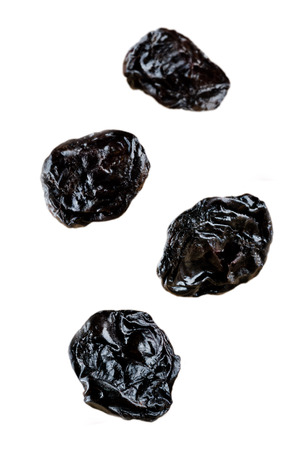 Four Flying Prunes fruits isolated. toning. selective focusの写真素材
