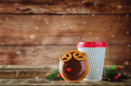 Donut with coffee on a wood background. toning. selective focusの写真素材