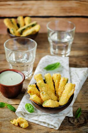 Baked Zucchini Fries with Pesto Greek yogurt sauce. toning. selective focusの写真素材